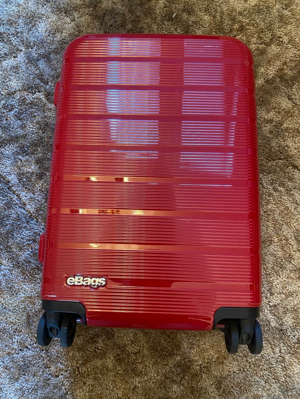 eBags Hard Shell Spinner Carry On Size Suit Case Luggage in Red Ribbed 22"